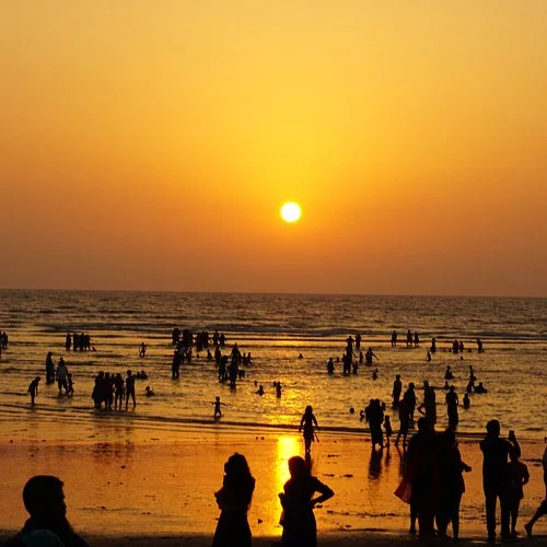 Students on a beach picnic at Alibaug on a day trip from Mumbai